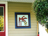 Eagle with Flag barn quilt attached to siding on a house